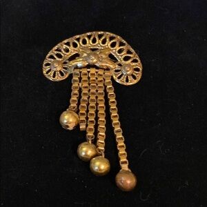 Elegant Gold Brooch with Chain Tassels